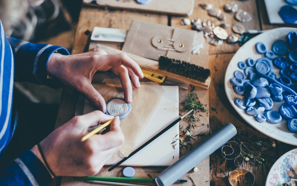 An artisan at work on a handcrafted piece
